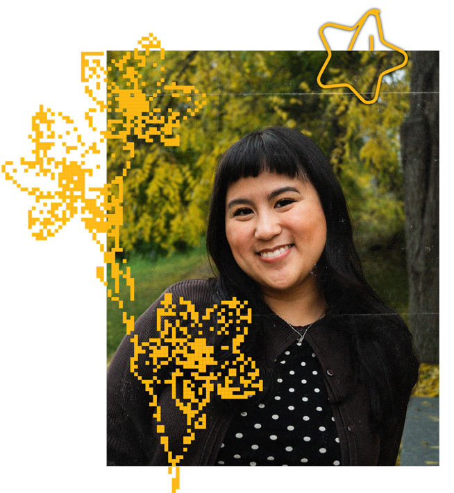 Paula Lucia Morella smiling outdoors, with autumn trees behind her
